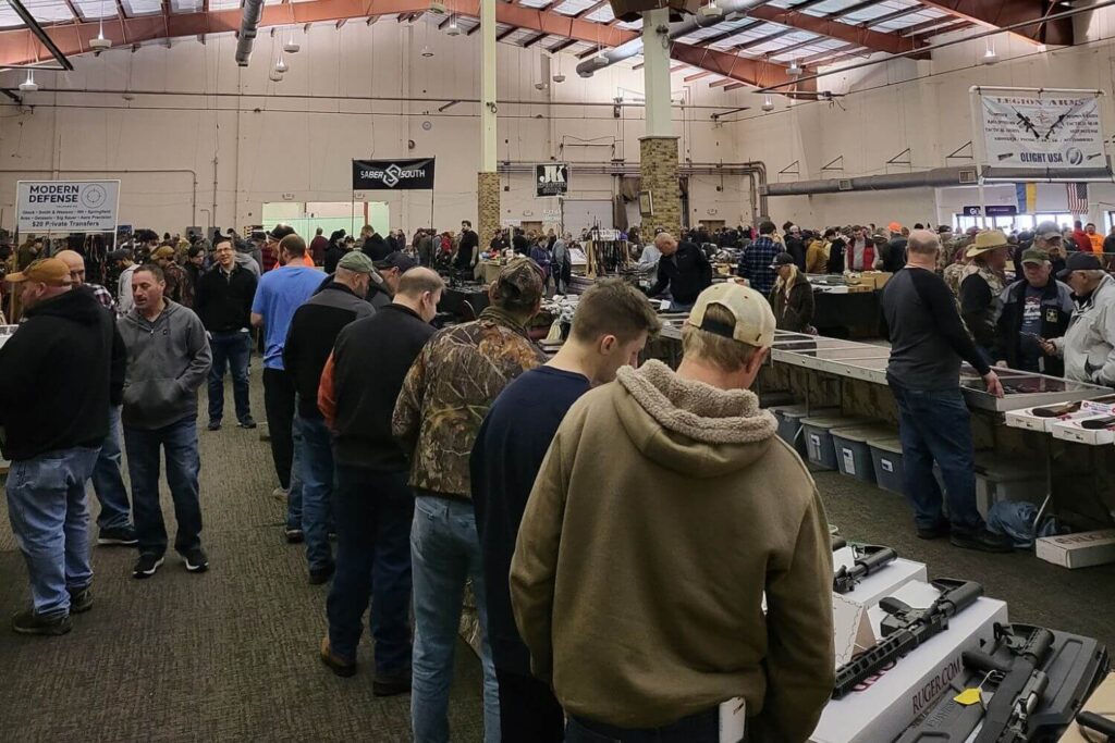 Shoppers gathered at different vendor booths at a local Gun Show