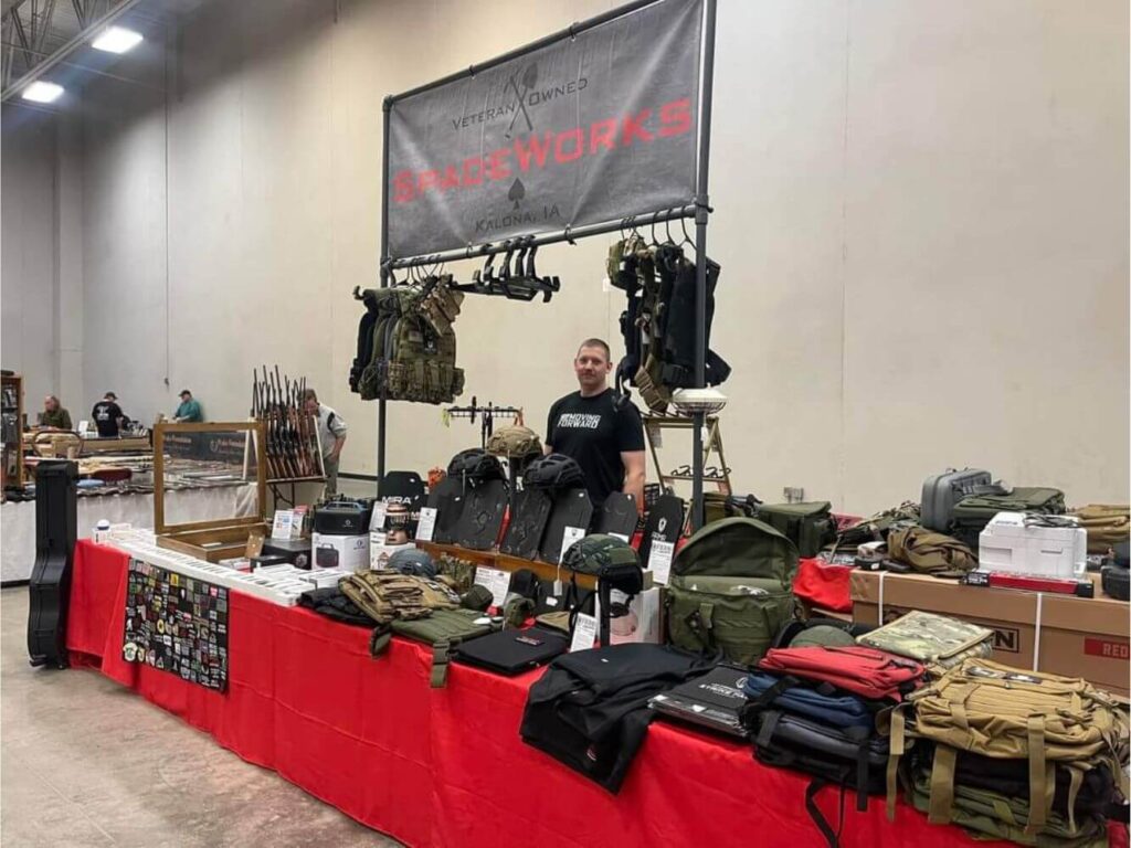 Tactical gear vendor table at a MAC Shows event
