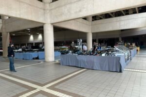 Gun show vendor tables set up at a MAC Shows gun and knife event