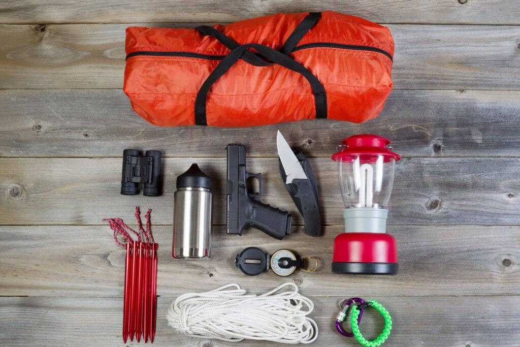 overhead view of tactical essentials displayed on wood