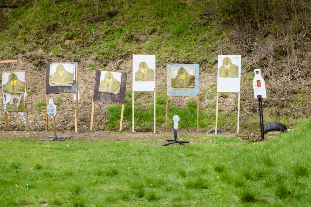 paper targets in a field at an outdoor shooting range