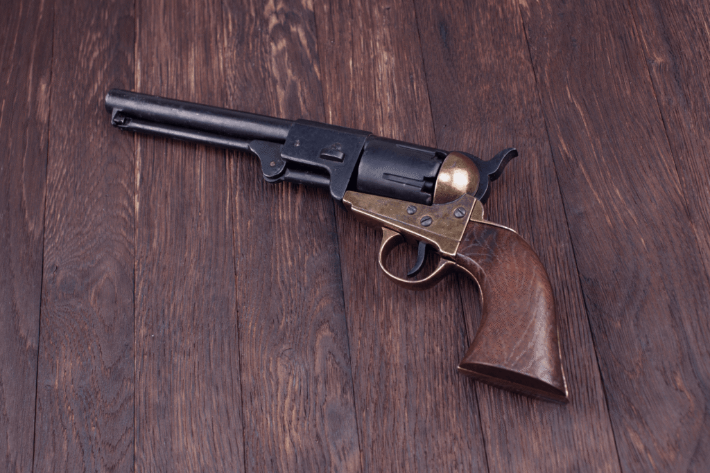 antique firearm on a wooden background