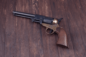 antique firearm on a wooden background
